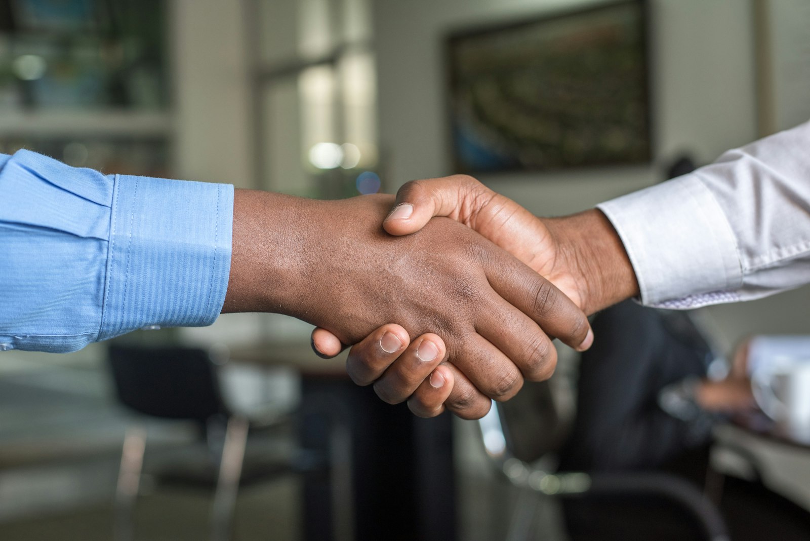 Advisor shaking hands with a client
